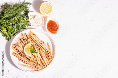 Wallpaper Mural Grilled scorzonera with sauces set with modern hard light, dark shadow Torontodigital.ca