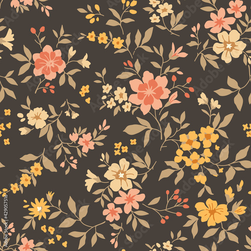 Cute seamless vector floral pattern. Endless print made of small yellow and orange flowers. Summer and spring motifs. Brown background. Stock vector illustration.