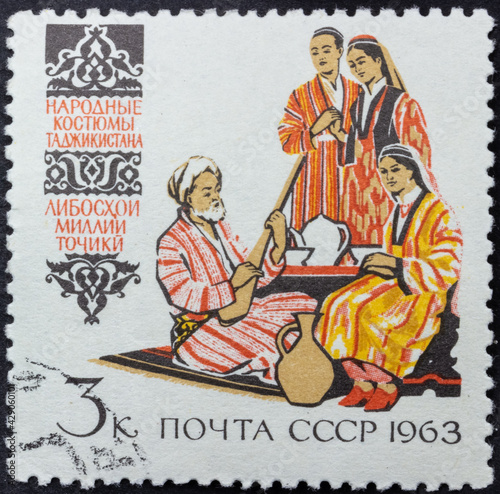 Postage stamp of 'Tajik folk costumes' printed in Republic of USSR. Series 'Costumes of the peoples of the USSR' by artist V. Pimenov, 1963