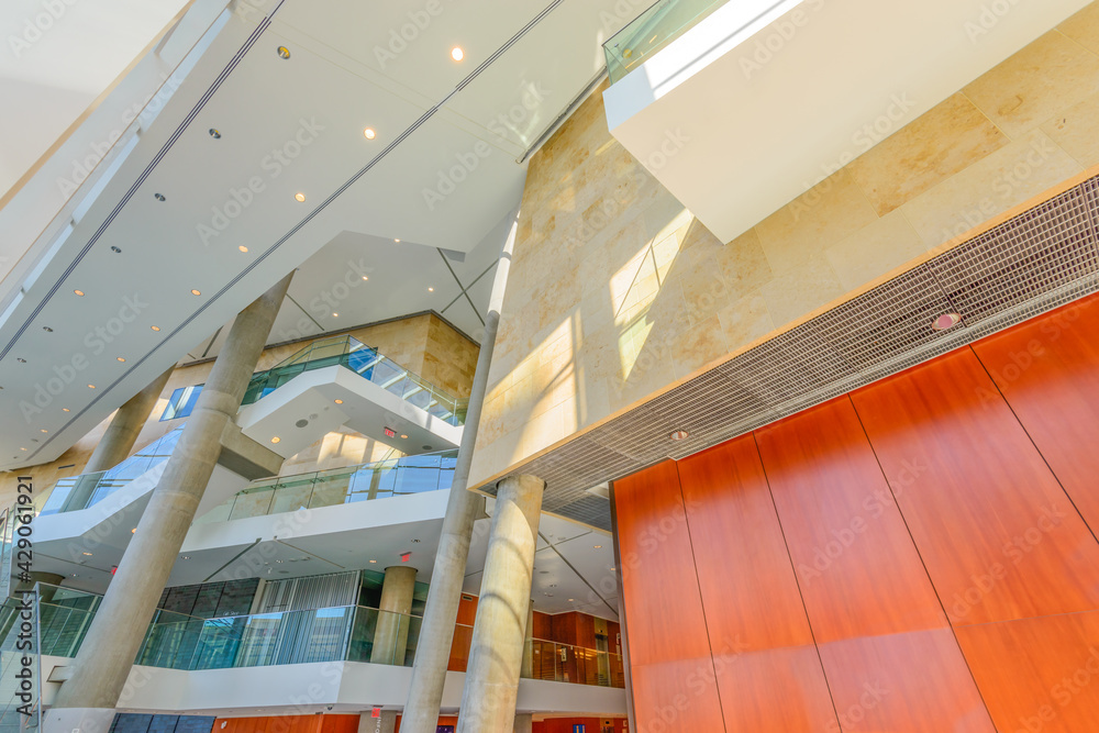 Obraz premium Painted in brown. Abstract fragment of the architecture of modern lobby, hallway of the luxury hotel, shopping mall, business center in Vancouver, Canada. Interior design.