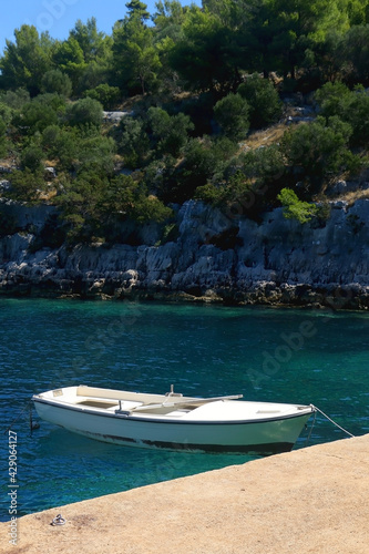 Small boat and beautiful clear sea on island Lastovo, Croatia. © jelena990