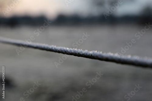 Zaun mit Frost im Winter