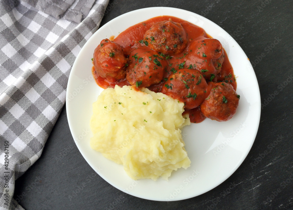 Meatballs in tomato sauce with mashed potatoes StockFoto Adobe Stock