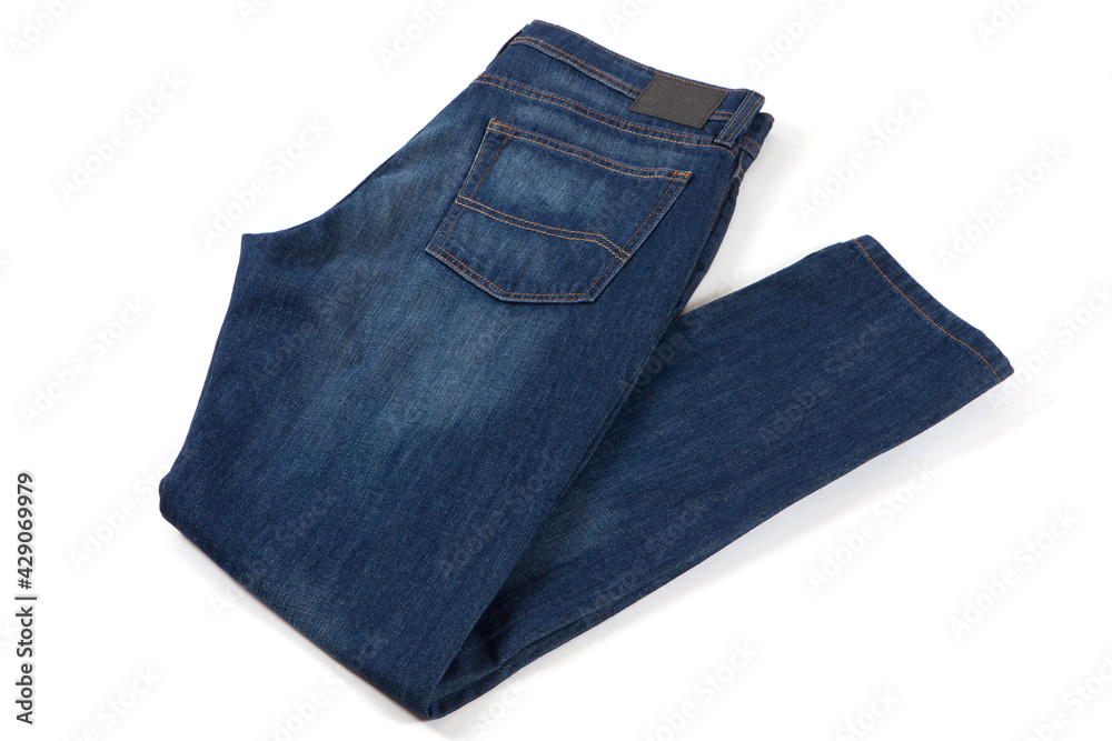 Blue jeans isolated on white background. Folded casual style trousers or pants. Blue jeans isolated on white background. Folded casual style trousers or pants.