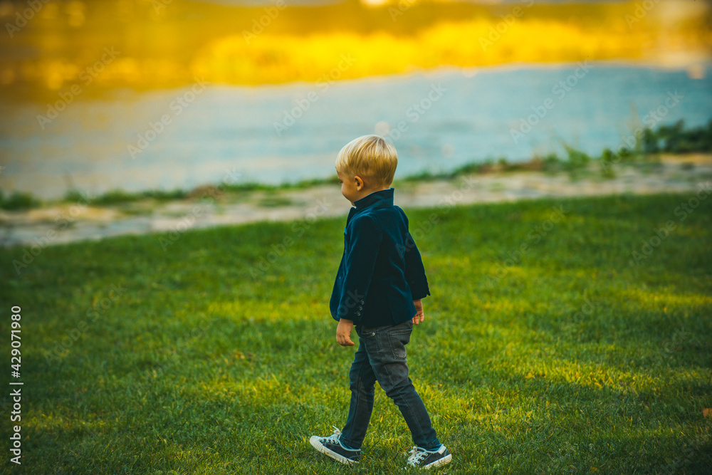 Child walking in park. Happy childhood. Kids autumn time. Child walking in park. Happy childhood. Kids autumn time.