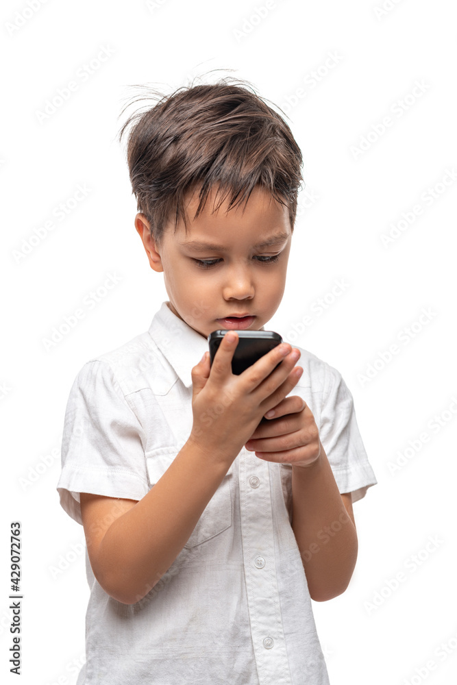 Little smiling boy talkes on the phone, isolated Little smiling boy talkes on the phone, isolated