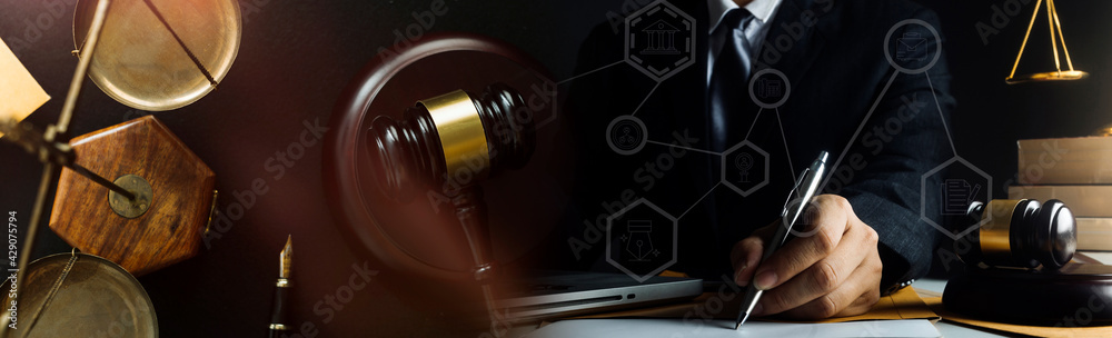 justice and law concept.Male judge in a courtroom on wooden table and Counselor or Male lawyer working in office. Legal law, advice and justice concept. justice and law concept.Male judge in a courtroom on wooden table and Counselor or Male lawyer working in office. Legal law, advice and justice concept.