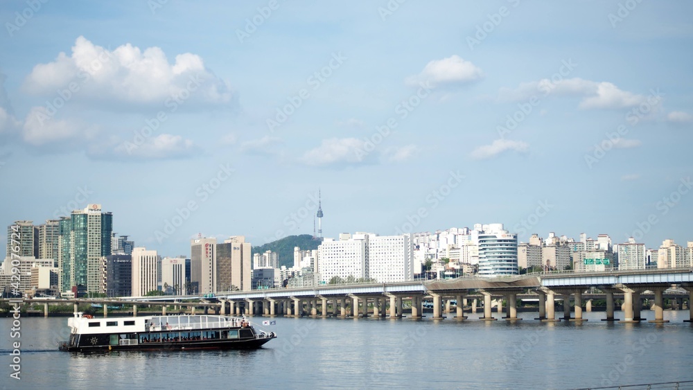 It is a landscape photograph view on the Han River in Seoul, South Korea. A place to relax, Yeouido Park.