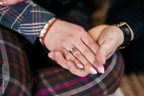 Bride and groom holding hands outdoors, wedding theme