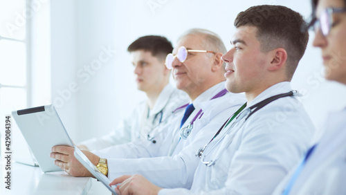 Medical team sitting and discussing at table