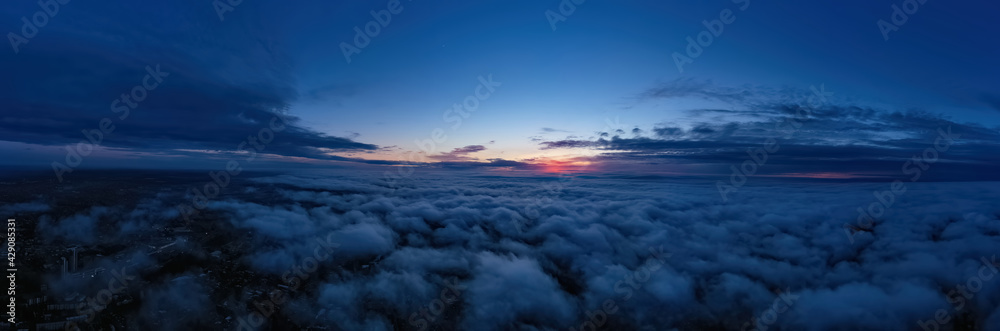 evening sunset sky panorama with some clouds. Panorama over clouds