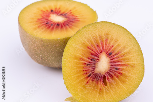 close-up view of fresh red kiwi fruit isolated on white background.