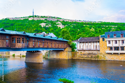 Covered wooden bridge in the town of Lovech in Bulgaria over the Osam river photo