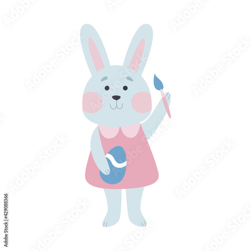 An Easter bunny in a pink dress paints eggs. A hare girl in festive clothes. Happy Easter, vector illustration with cartoon character