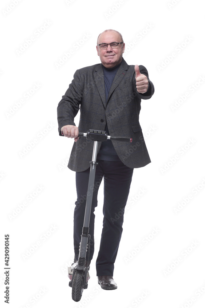 full growth . Mature business man with an electric scooter