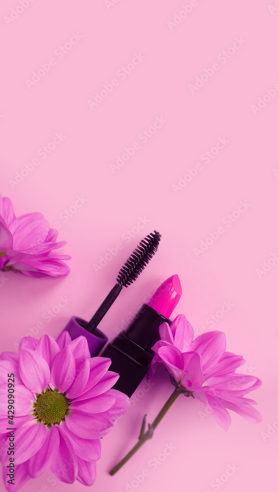 lipstick, mascara flower on a colored background lipstick, mascara flower on a colored background