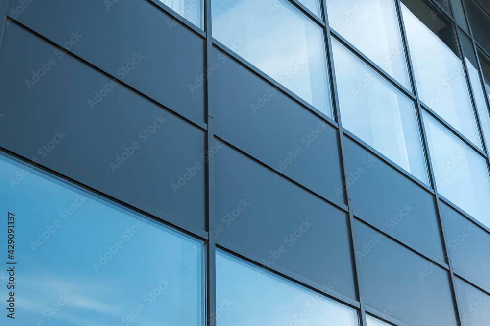 Geometric colored building facade elements with planes, lines and corners with light flare and reflections for an abstract background and texture of white, blue, gray colors. Place for text Geometric colored building facade elements with planes, lines and corners with light flare and reflections for an abstract background and texture of white, blue, gray colors. Place for text