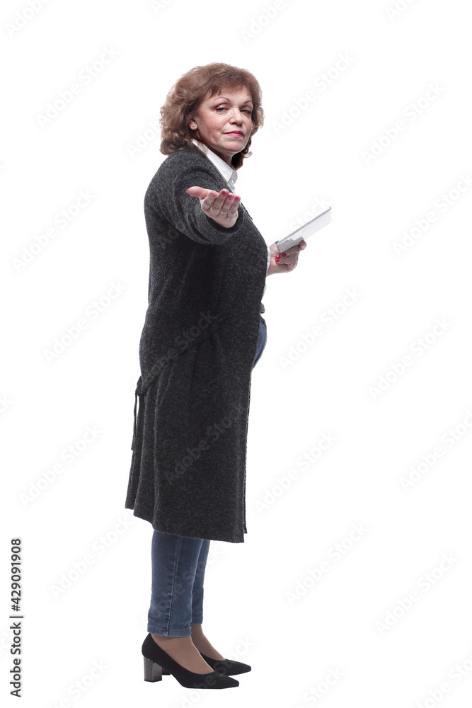 side view. mature woman using a digital tablet side view. mature woman using a digital tablet