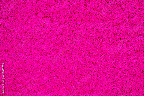 Porous marerial made of rose synthetic thread, bright flashy background photo