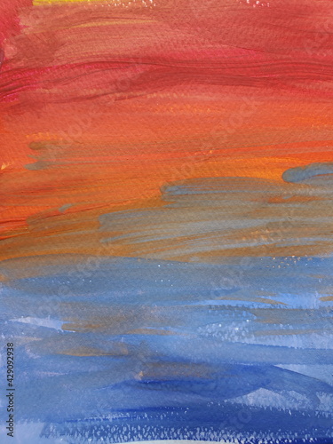 Paintbrush strokes on rough watercolor paper. Gradient stripes of vibrant color paints looking like rainbow or sunset sky. Closeup shot of colorful painted paper texture