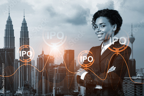 Canvas Print Successful smiling attractive black businesswoman in suit is considering to set up IPO to ensure the clients business development