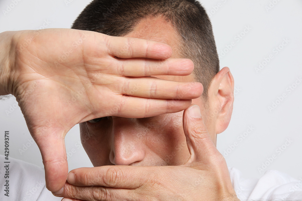 Portrait of man playing with his hands. Mental issues. Psychology.