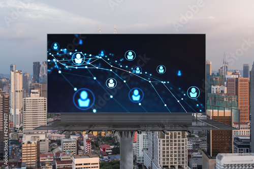 Photography Glowing Social media icons on billboard over sunset panoramic city view of Kuala Lumpur, Malaysia, Asia