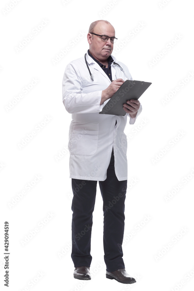 in full growth. serious doctor taking notes in the clipboard in full growth. serious doctor taking notes in the clipboard