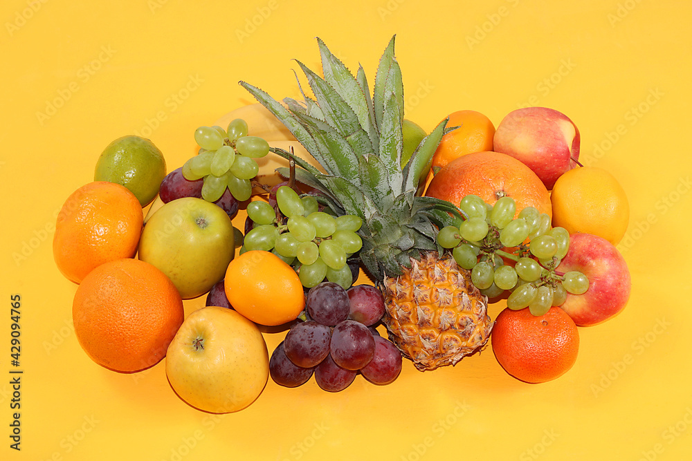 Tropical fruits, pineapple, grapefruit, orange, banana, grapes, lemon, shop banner. Detox diet, minimal summer vacation concept, flat lay, healthy natural food. Selective focus