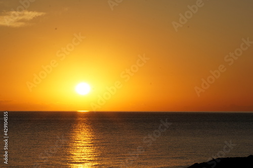 Fototapeta Naklejka Na Ścianę i Meble -  Sunrise over the calm sea