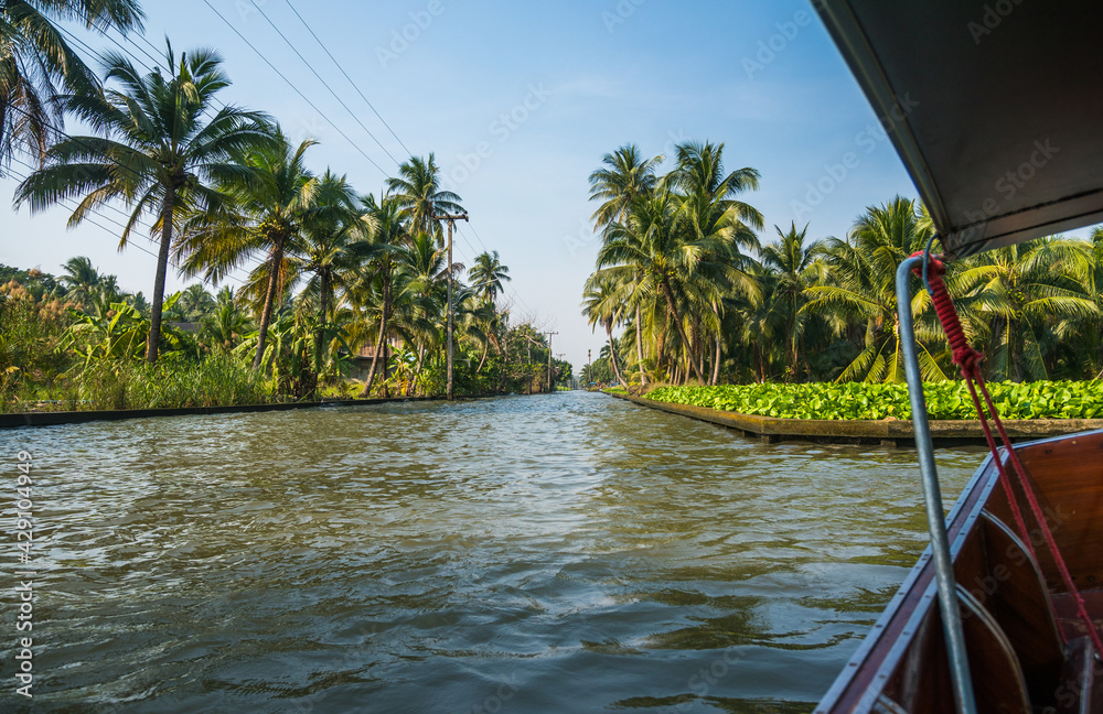 Passenger Motor Boat on a Canal Leading to Famous Floating Market in Bangkok, Thailand