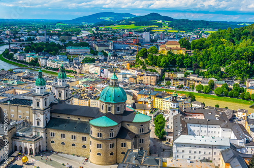 Aerial panoramic view of the historic city of Salzburg including Mirabell palace, the Salzburg cathedral and many churches. photo