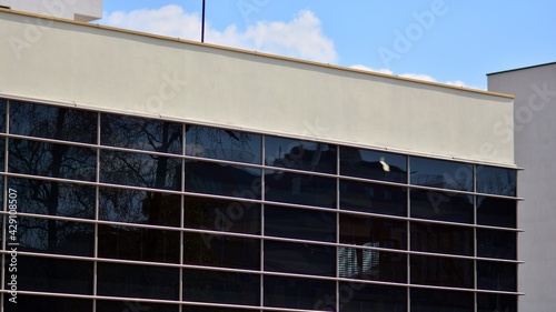 Wallpaper Mural The glazed facade of an office building with reflected sky. Modern architecture buildings exterior background. Clouds sky reflection. Torontodigital.ca