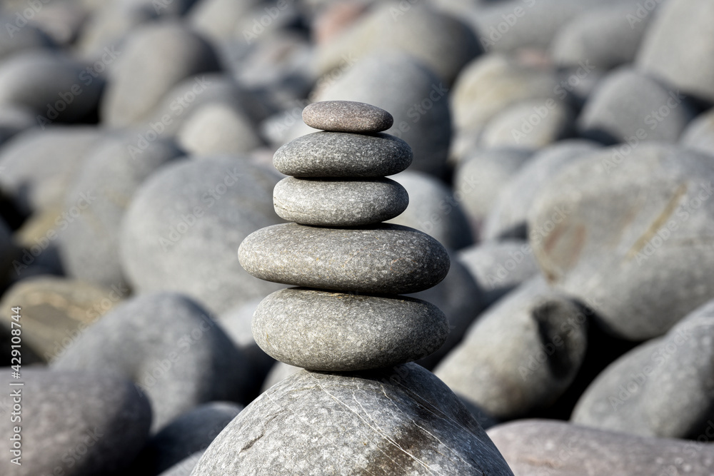 Pebble stack on the beach the stones represent balance and wellbeing of the mind