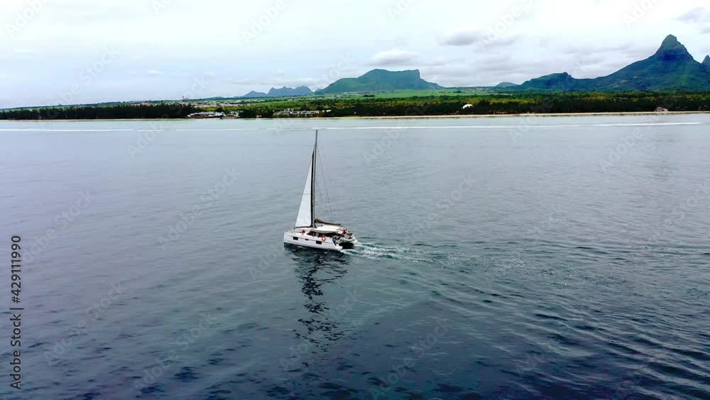 Aerial view, flight at Katamaran at the blue sea, Mauritius, Africa Aerial view, flight at Katamaran at the blue sea, Mauritius, Africa
