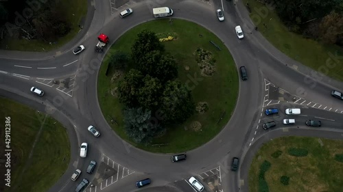 aerial drone timelapse footage for busy roundabout ascending 10sec photo