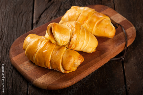 Traditional fresh baked croissants on the table. photo