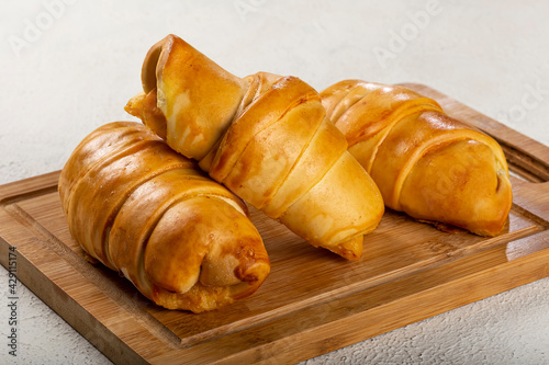 Traditional fresh baked croissants on the table. photo