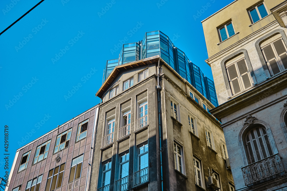04.03.2021. Turkey istanbul. A old style building with widen with glass made materials and has modern type of structure in istiklal avenue in istanbul during early in the morning. 04.03.2021. Turkey istanbul. A old style building with widen with glass made materials and has modern type of structure in istiklal avenue in istanbul during early in the morning.