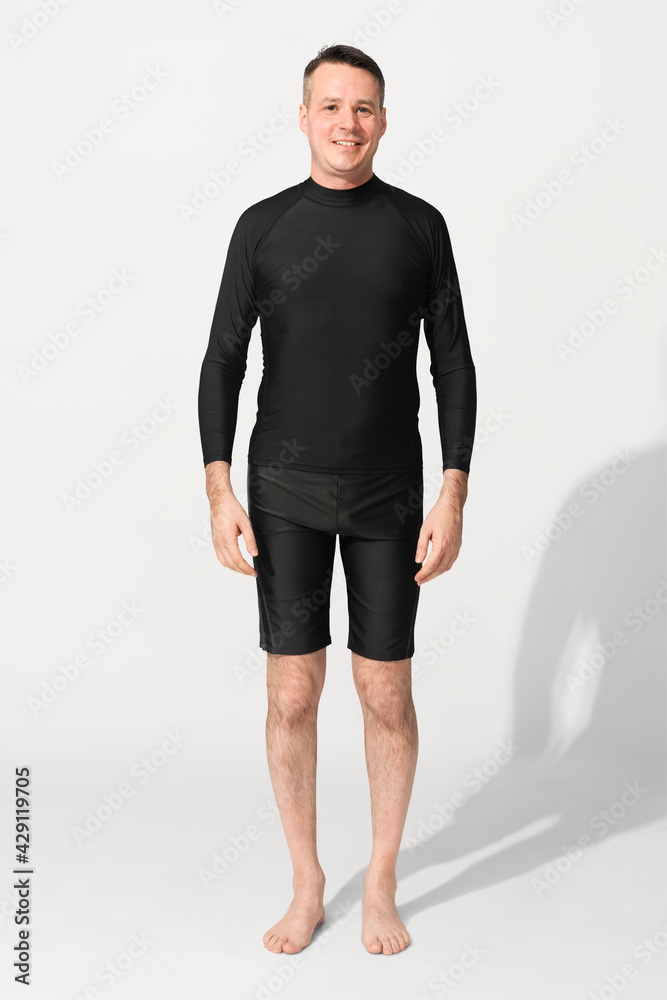 Man wearing black rash guard mockup psd and swim shorts
