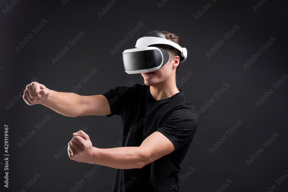Man with VR playing racing game entertainment technology Man with VR playing racing game entertainment technology