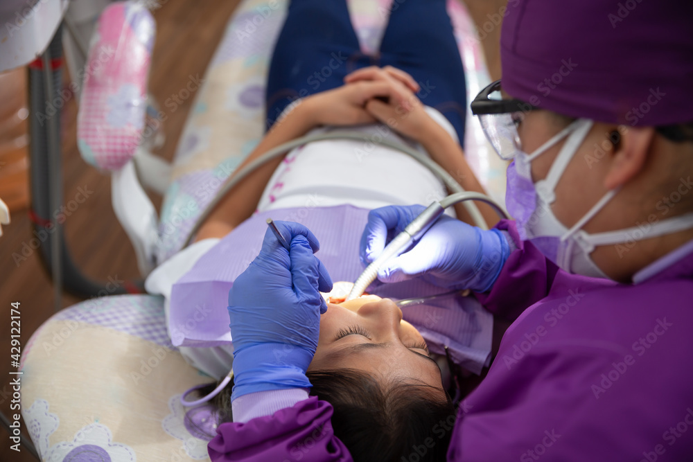 Mexican dentist, Medical checkup oral cavity of female patient with