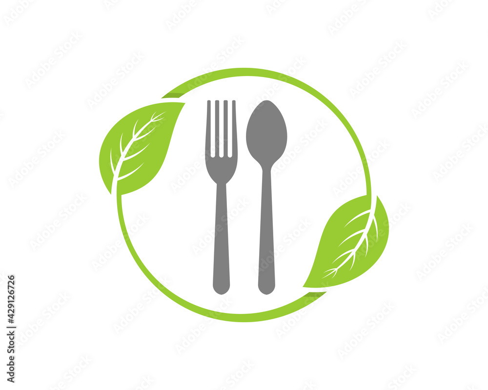 Fork and spoon inside the circle green leaf Fork and spoon inside the circle green leaf