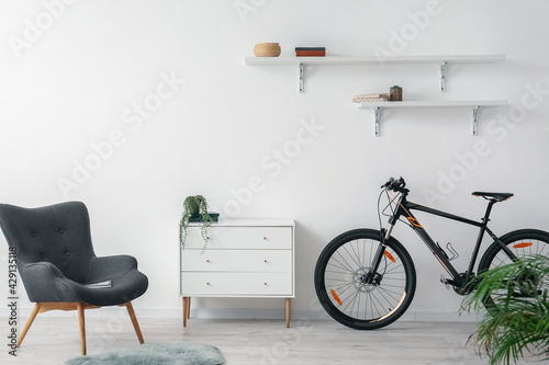 Fototapeta Naklejka Na Ścianę i Meble -  Modern bicycle in interior of living room