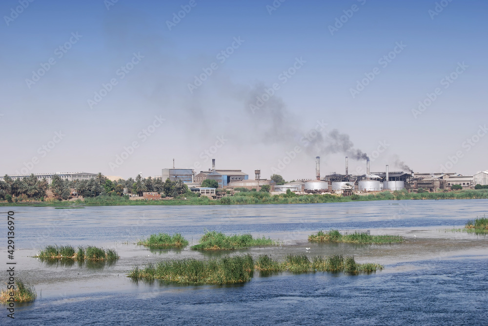 Factory on the Nile river shore, southern Egypt, Africa. Cruising on Nile River.