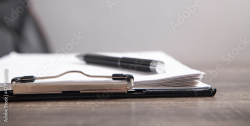 Contract and pen on the desk. Business concept