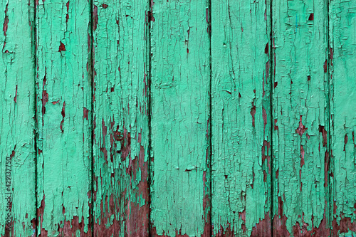 texture of cracked mint paint on wooden wall