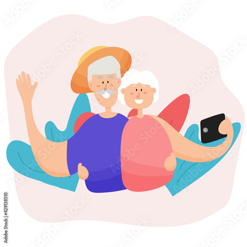 An elderly couple takes a selfie while traveling. Active grandparents travel together.