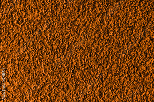 Dark orange plaster facade texture background. External facade of the building  plaster with clear texture.