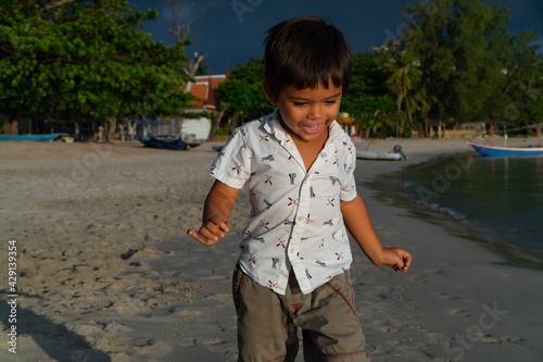 child playing on the beach